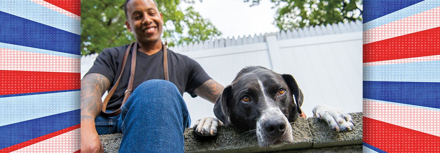 Veteran smiling with their service dog