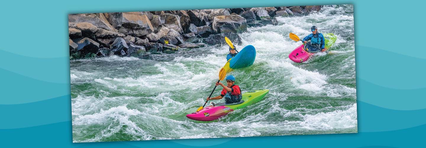 Photo of people kayaking down treacherous river